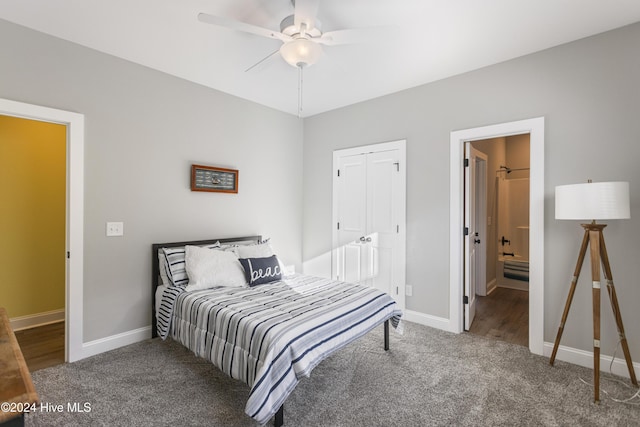 bedroom with carpet flooring, ensuite bath, and ceiling fan