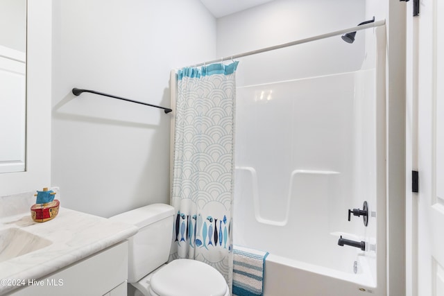 full bathroom with vanity, shower / tub combo, and toilet