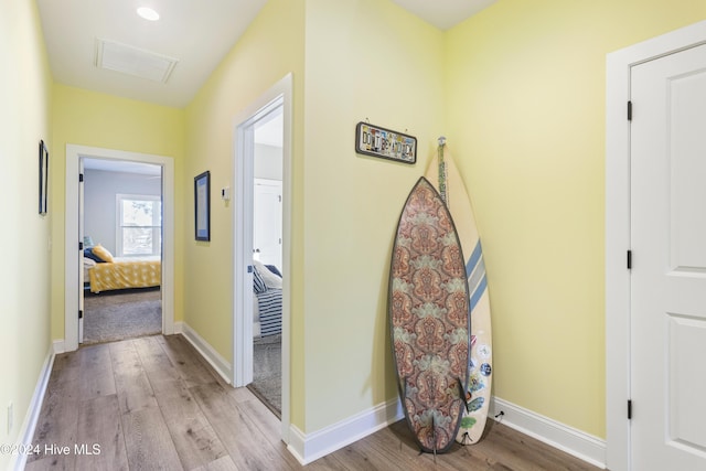 hall with light hardwood / wood-style flooring