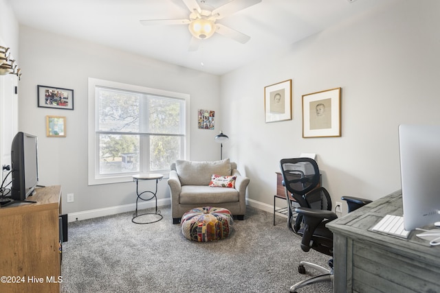 carpeted office space featuring ceiling fan