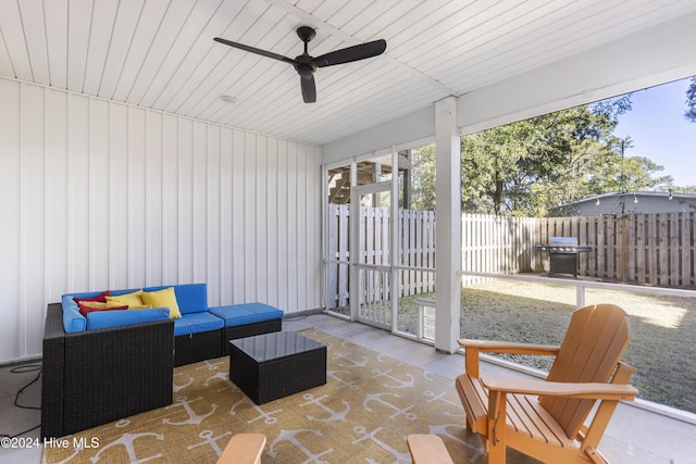 sunroom / solarium with ceiling fan and wood ceiling