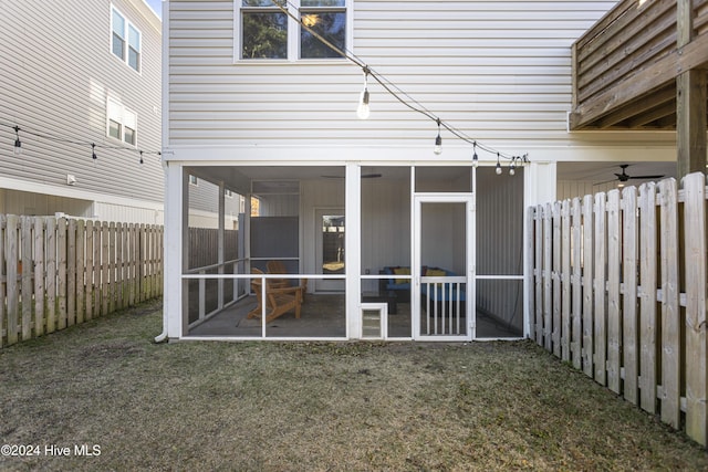 exterior space featuring a sunroom and a yard