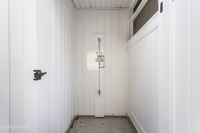 interior space featuring wooden walls