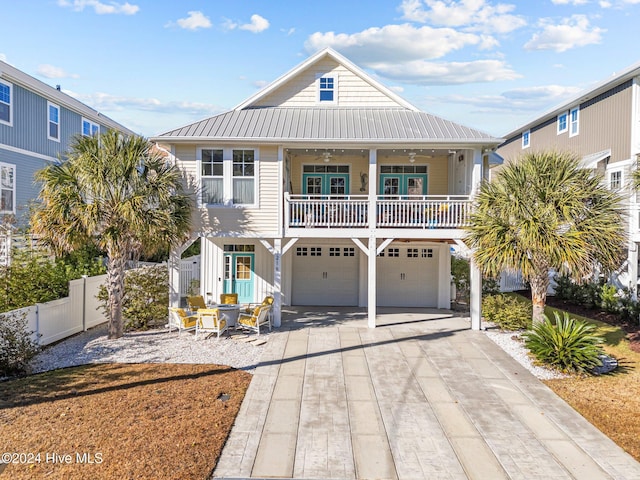 raised beach house with a garage