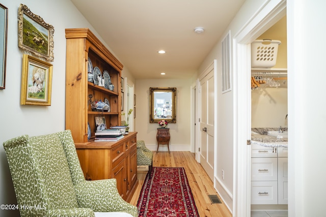 hallway featuring light wood-type flooring