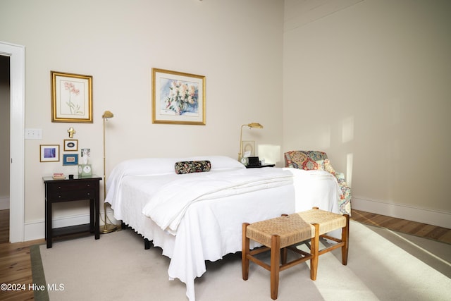 bedroom with wood-type flooring