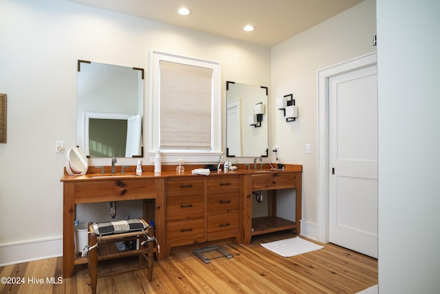 bathroom featuring vanity and hardwood / wood-style flooring