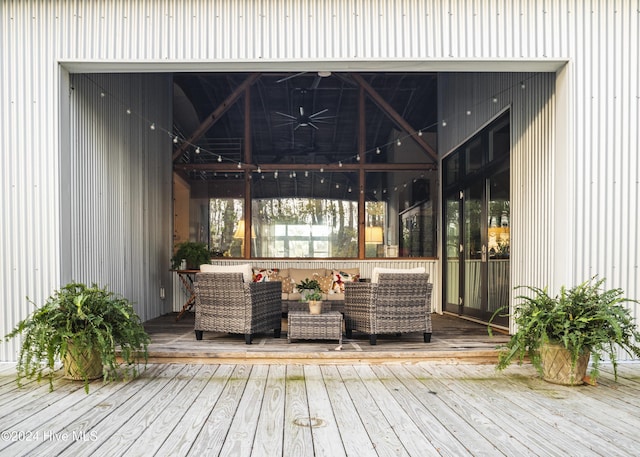 wooden terrace featuring an outdoor living space