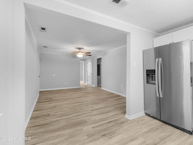 kitchen featuring white cabinets, ceiling fan, stainless steel fridge, light wood-type flooring, and a textured ceiling