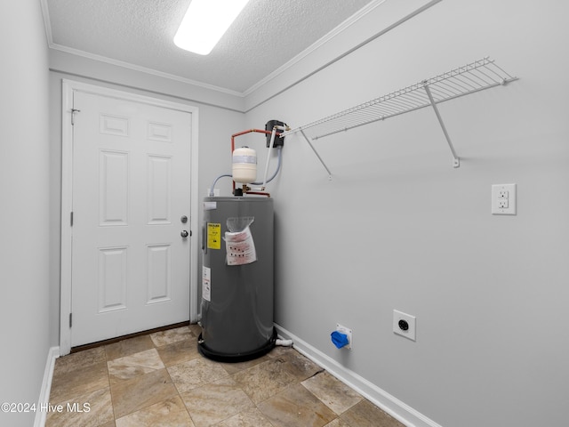 laundry room featuring electric dryer hookup, crown molding, a textured ceiling, and water heater