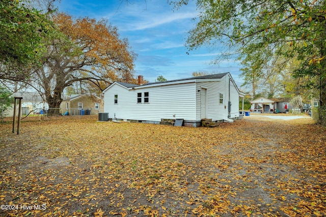 view of side of property with central AC