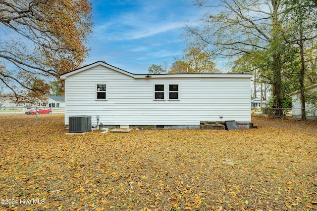 back of house featuring central AC unit