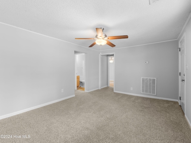 unfurnished room featuring a textured ceiling, light colored carpet, and ceiling fan