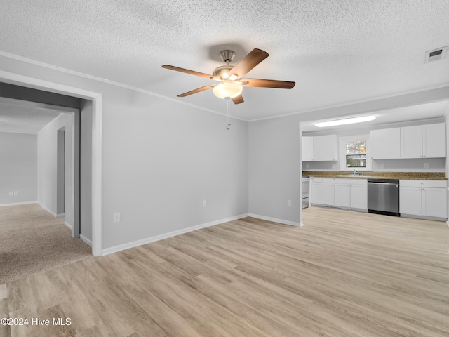 unfurnished living room featuring a textured ceiling, light hardwood / wood-style floors, ceiling fan, and ornamental molding