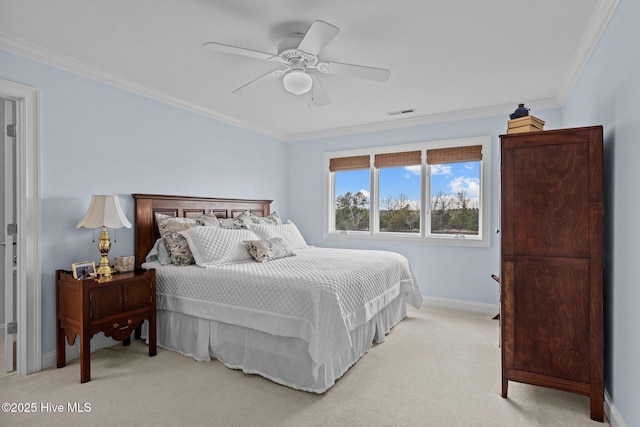 bedroom with ceiling fan, light colored carpet, and ornamental molding