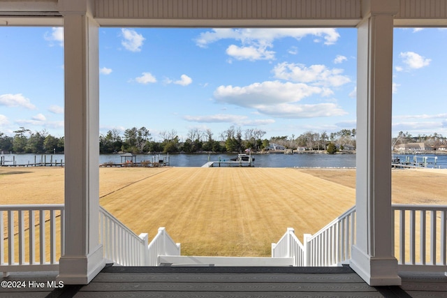 wooden deck with a water view