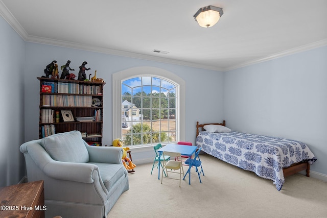 carpeted bedroom featuring crown molding