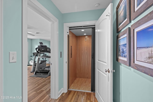 corridor featuring light hardwood / wood-style floors