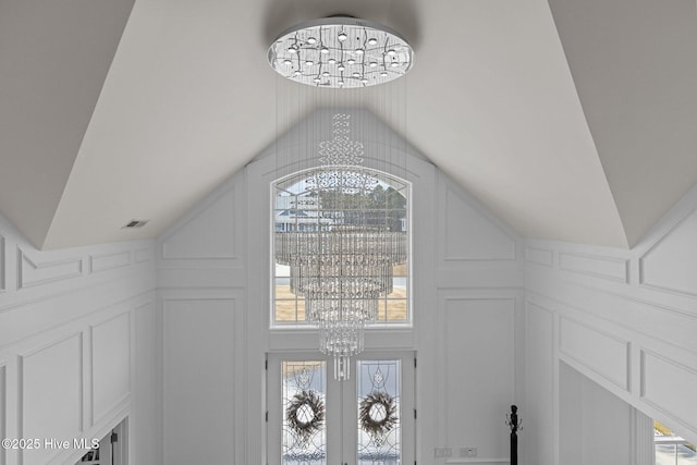 details with french doors and a chandelier