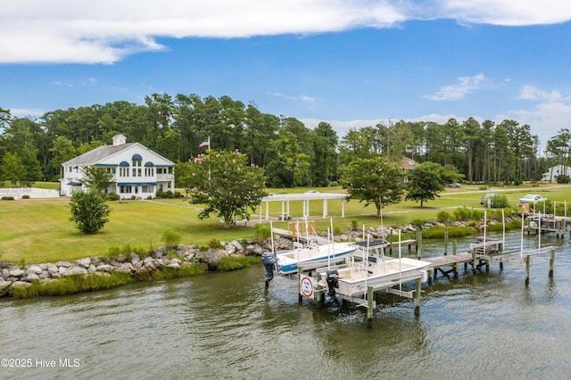 view of dock featuring a water view, a lawn, and a pergola