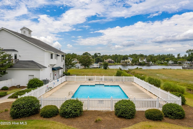 view of swimming pool featuring a water view