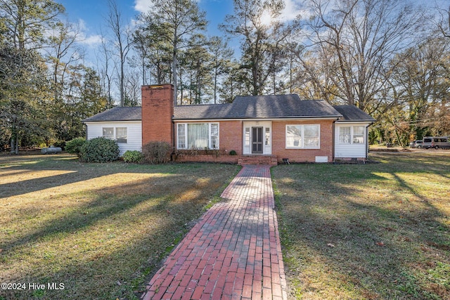 single story home with a front yard