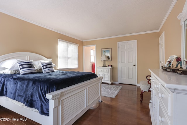 bedroom with a textured ceiling, dark hardwood / wood-style flooring, and crown molding