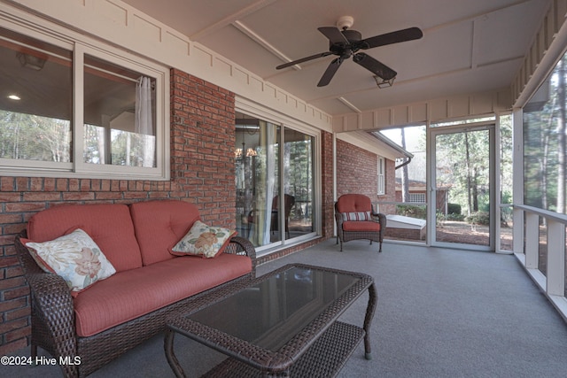 sunroom / solarium featuring ceiling fan