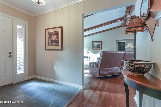 entryway featuring vaulted ceiling with beams, a wealth of natural light, dark hardwood / wood-style flooring, and ornamental molding