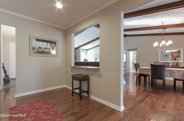 hallway with vaulted ceiling with beams, ornamental molding, dark wood-type flooring, and a chandelier