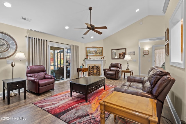 living room with ceiling fan, high vaulted ceiling, and wood-type flooring