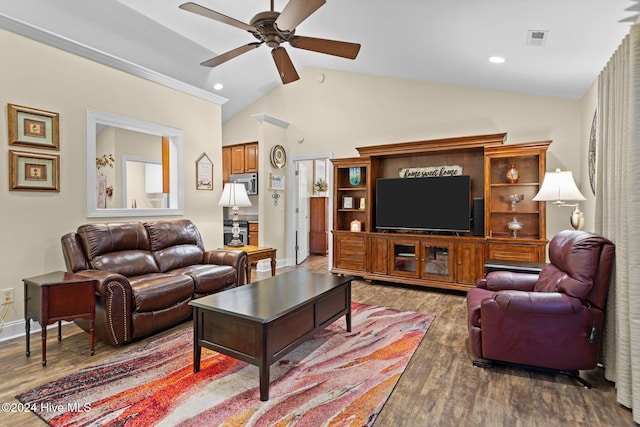 living room with ceiling fan, dark hardwood / wood-style floors, and vaulted ceiling