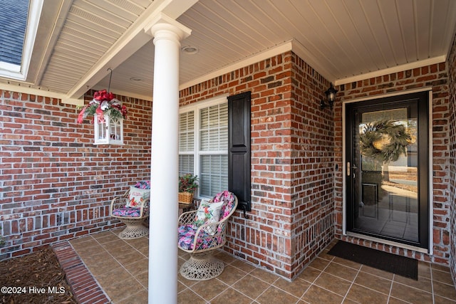 doorway to property with covered porch