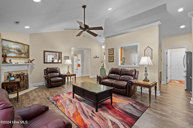 living room with ceiling fan, hardwood / wood-style floors, and lofted ceiling