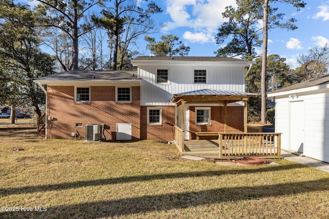 rear view of property with a wooden deck, a lawn, and central air condition unit