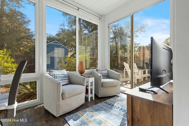 sunroom with a wealth of natural light and wooden ceiling