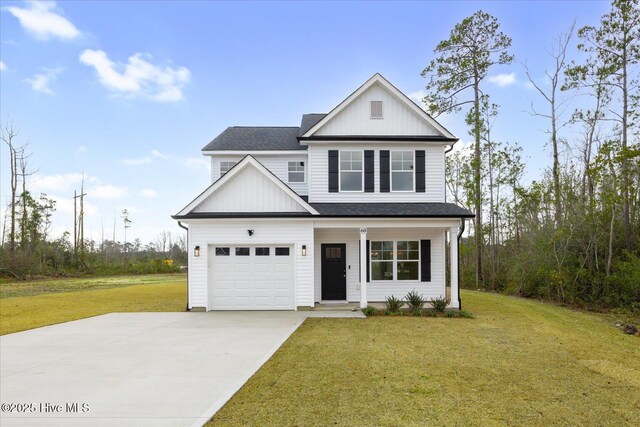 view of property with covered porch and a garage