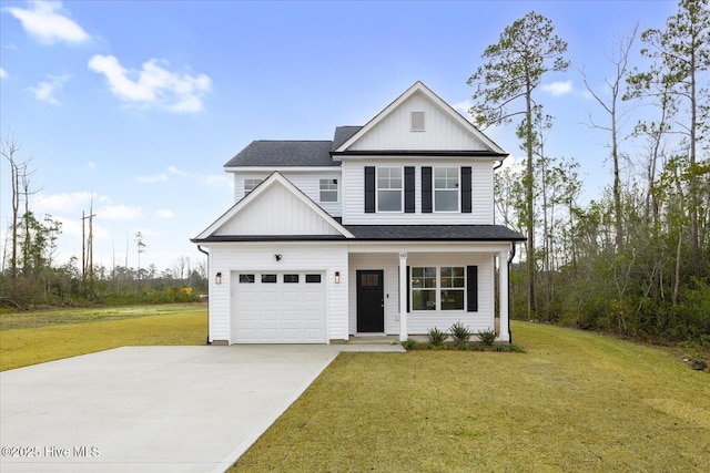 view of front of house with an attached garage, driveway, board and batten siding, and a front yard