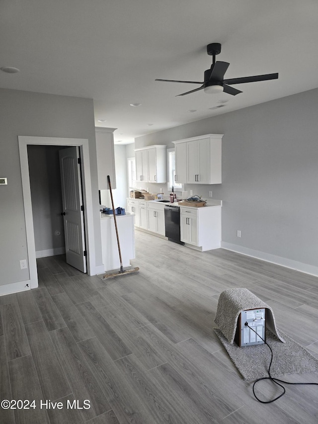 kitchen with white cabinets, light hardwood / wood-style floors, ceiling fan, and dishwasher