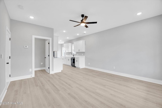 unfurnished living room with light wood-type flooring, a ceiling fan, and recessed lighting