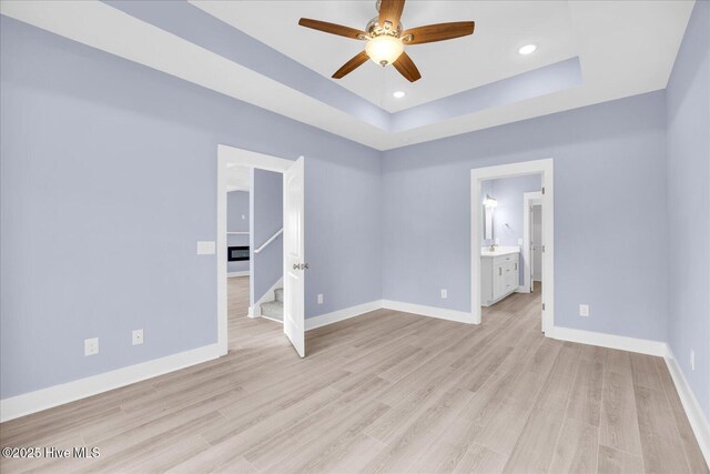 bathroom with a wealth of natural light and a shower with shower door