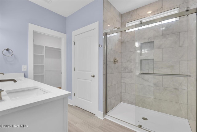 interior details featuring a tile shower