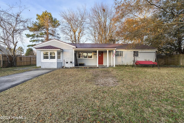 view of front of property with a front lawn and covered porch