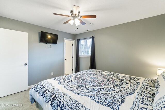 carpeted bedroom featuring ceiling fan