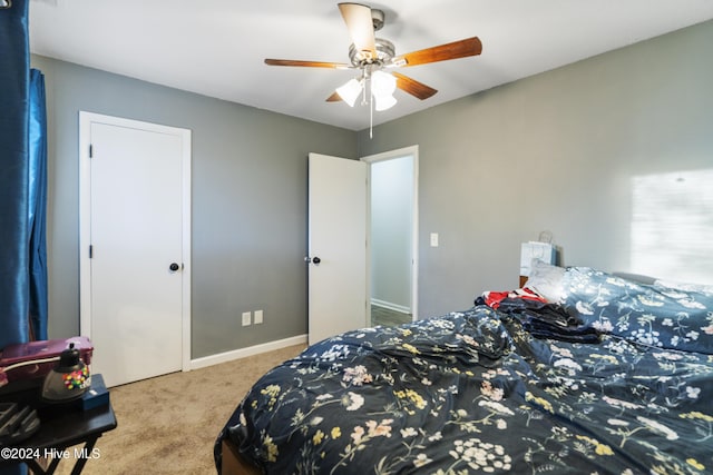 carpeted bedroom featuring ceiling fan