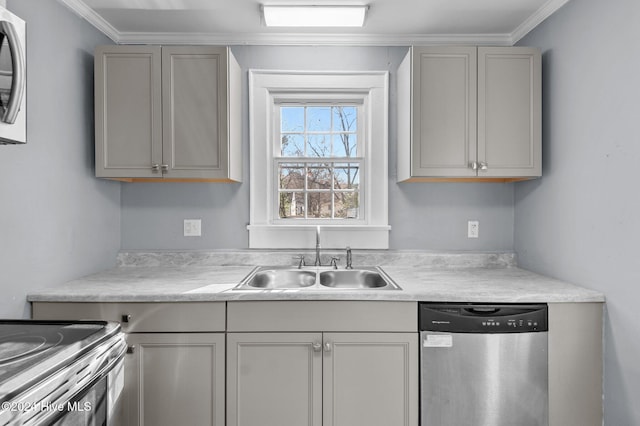 kitchen featuring gray cabinetry, sink, ornamental molding, and stainless steel appliances