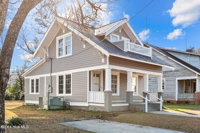 view of front of home with a balcony and a porch