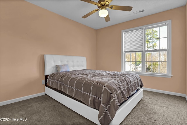 carpeted bedroom with ceiling fan