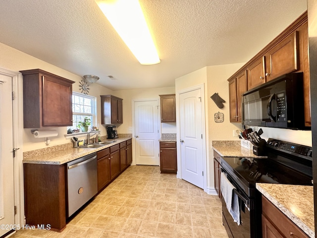 kitchen featuring sink, black appliances, a textured ceiling, and light stone countertops