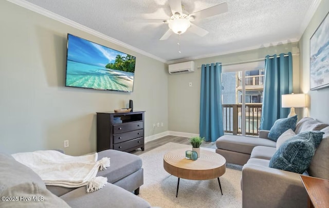 living room featuring crown molding, light hardwood / wood-style flooring, a textured ceiling, an AC wall unit, and ceiling fan